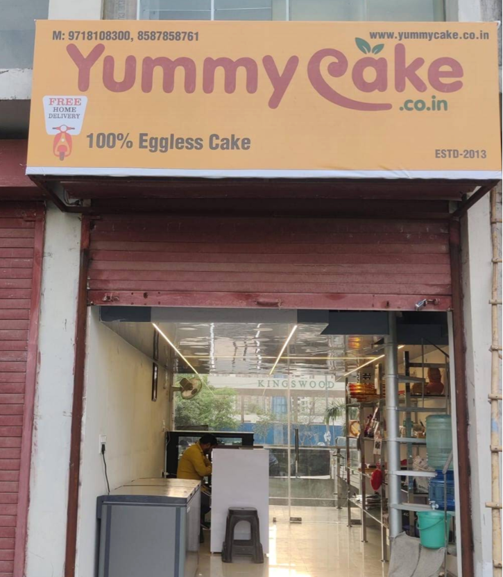 YummyCake shop front with 100% Eggless signboard